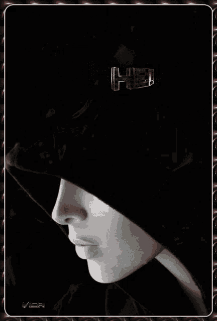 a black and white photo of a woman 's face with the word hello above her