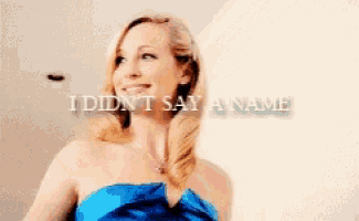 a woman in a blue dress with the words i did n't say a name above her