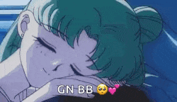 a girl with green hair is sleeping in a bed with the words `` gn bb '' written on the bottom .