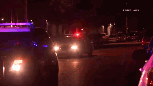 a u-haul truck is parked in front of a police vehicle