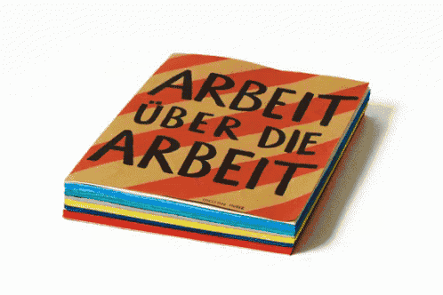 a book titled arbeit über die arbeit is stacked on top of a stack of other books