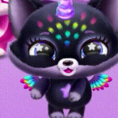 a close up of a stuffed animal with wings and a unicorn horn on its head .