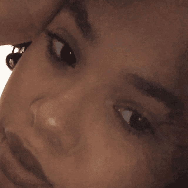 a close up of a person 's face with a smile on it