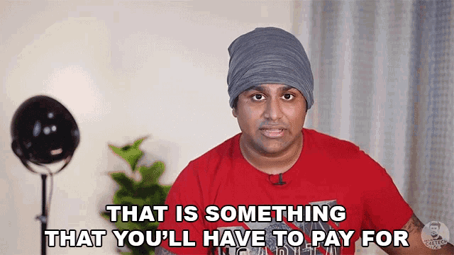 a man wearing a red shirt and a gray beanie says that is something that you 'll have to pay for