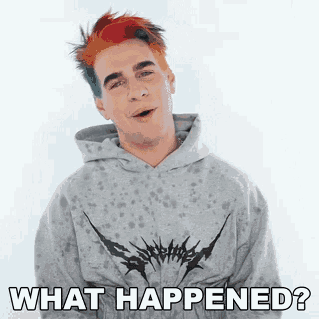 a man with colorful hair is wearing a hoodie and asking what happened