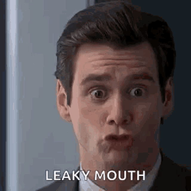 a man in a suit and tie is making a funny face and says `` leaky mouth '' .