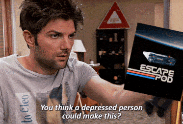 a man is holding a escape pod poster in his hand