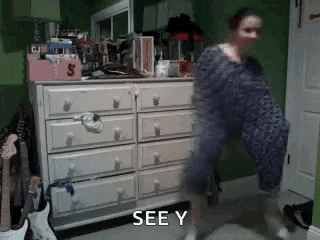a woman is dancing in front of a dresser with the words see y written on the bottom .