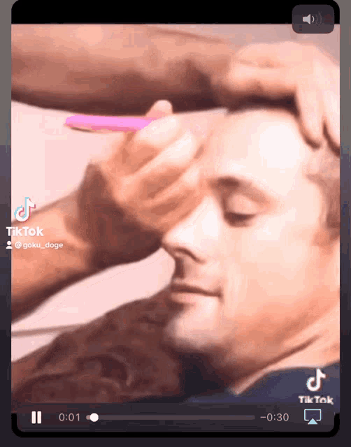 a tiktok video shows a man getting his hair cut