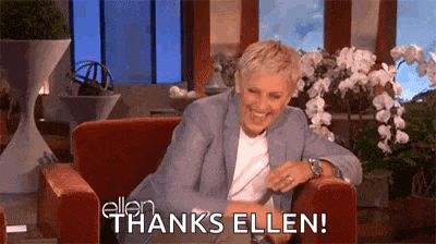 ellen degeneres is sitting in a chair laughing and saying thanks ellen !