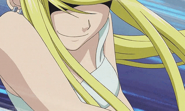 a close up of a woman with long blonde hair