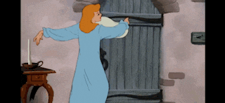 a cartoon of a woman in a blue robe standing in front of a door