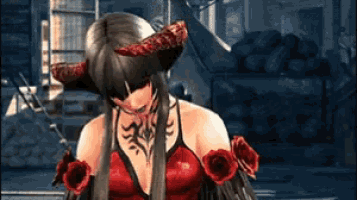 a woman in a red dress has a tattoo on her arm