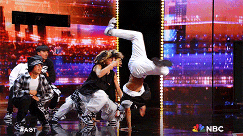 a group of dancers on a stage with nbc written on the bottom