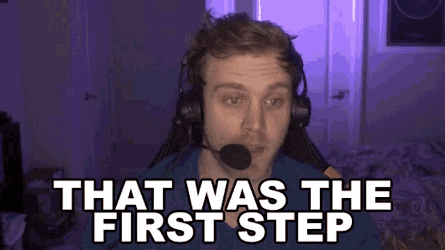 a man wearing headphones and a microphone says " that was the first step "