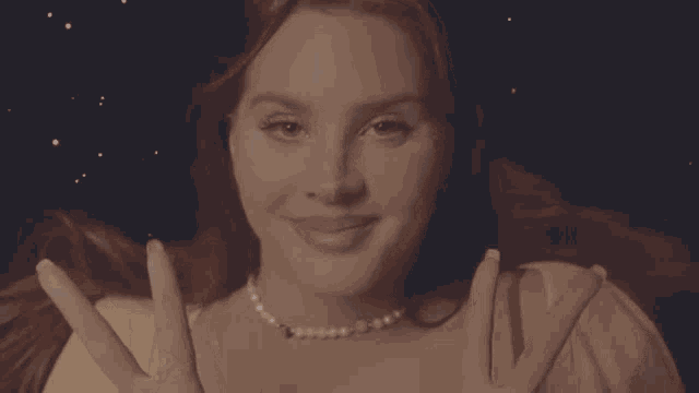 a close up of a woman sticking her tongue out .