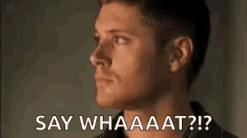 a close up of a man 's face with the words `` say whaaaat ? ''