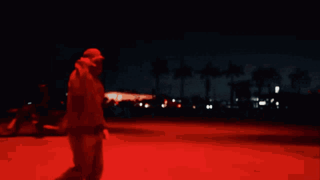 a blurry picture of a man in a red light