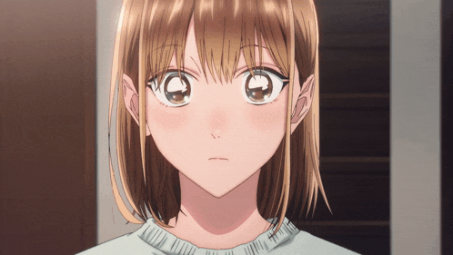 a close up of a girl with brown hair and a white shirt