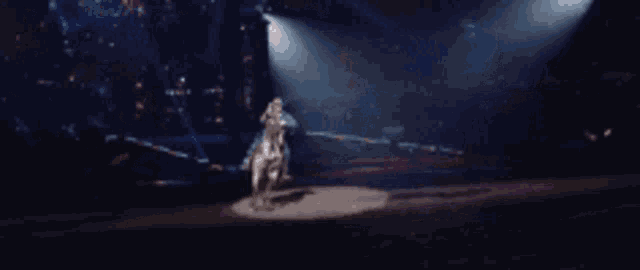 a man is riding a horse on a stage at a circus