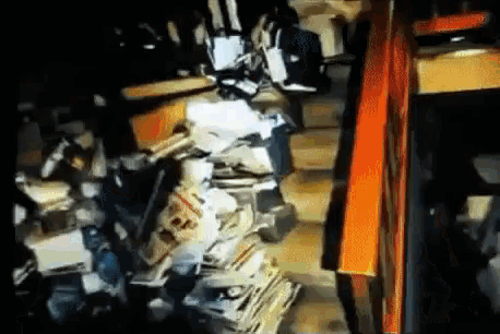 a staircase filled with lots of junk and boxes .