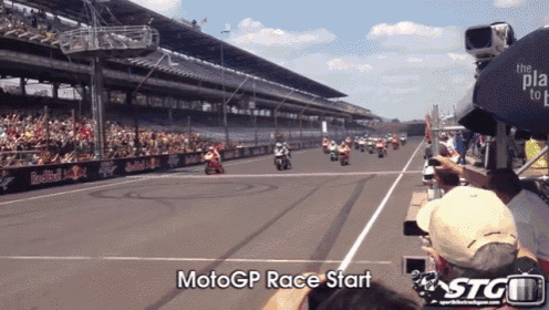 a motogp race start is being filmed by stg tv