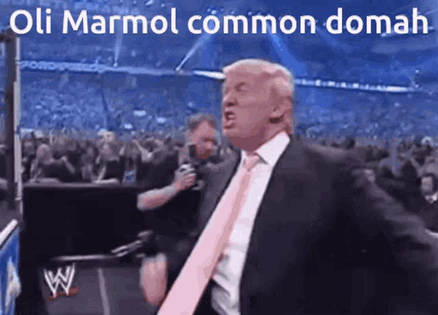 a man in a suit and tie is dancing in front of a crowd with the words oli marmol common domah written on the bottom