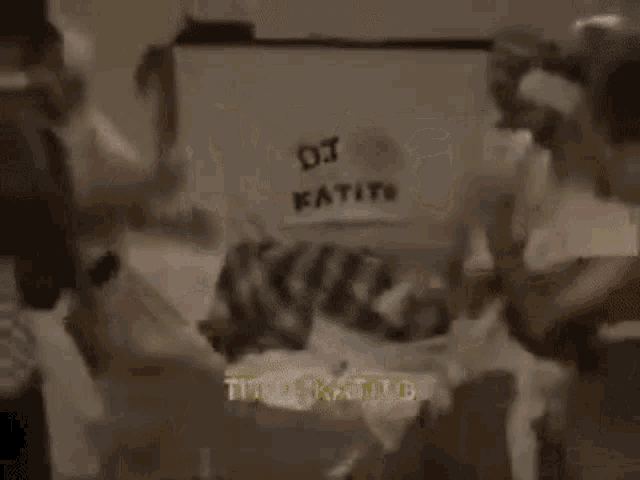 a group of people are standing in a room dancing .