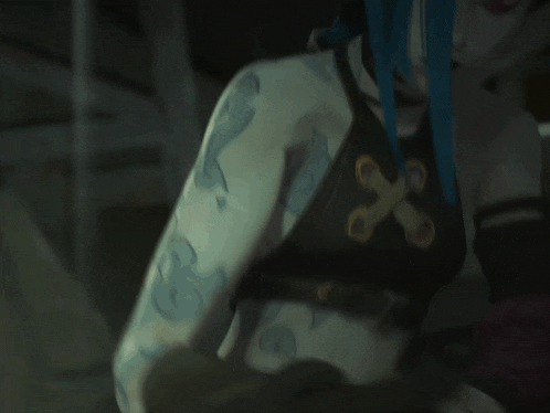 a close up of a person 's shoulder with a cross on it