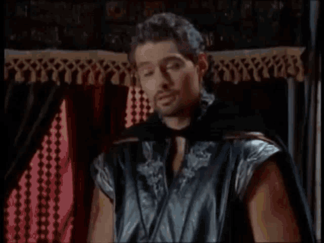 a man in a black cape is asking is this a bad time