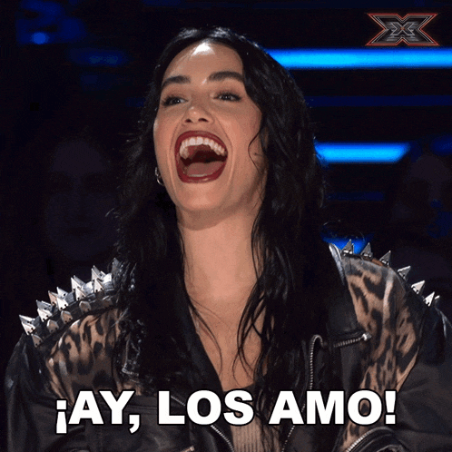 a woman in a leopard print jacket is laughing with the words ay los amo