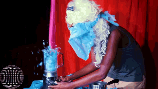a woman in a wig is making a smoothie