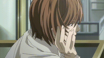 a close up of a person 's face with their hands on their face