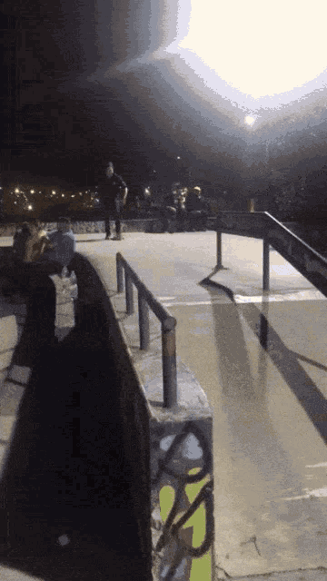 a skateboarder is doing a trick on a ramp with graffiti on it