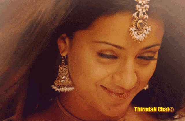 a close up of a woman 's face with a watermark that says thiruda n chat on it