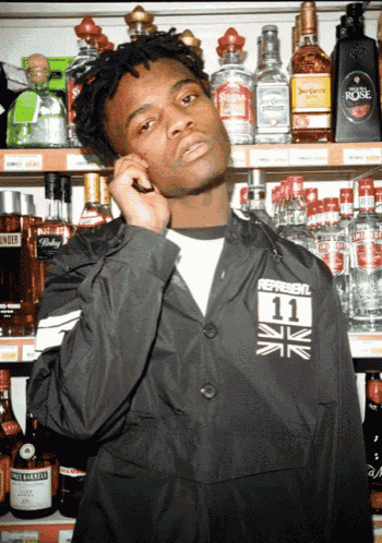 a man wearing a jacket that says represent 11