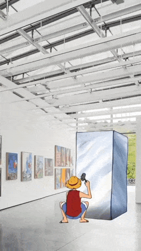 monkey d luffy is squatting down in front of a large cube in a museum