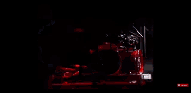 a man is playing drums on a stage with a drum set .