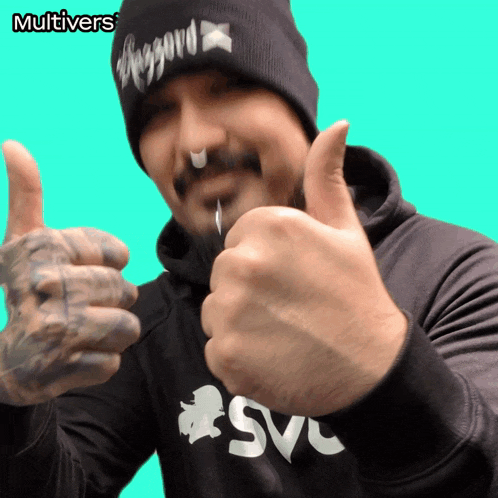 a man giving a thumbs up in front of a green background with the words multivers on it