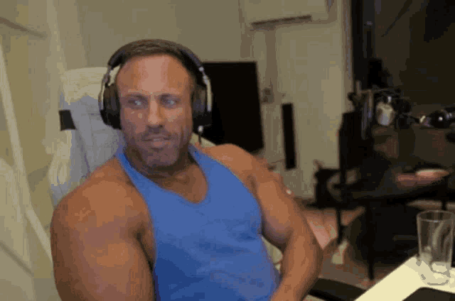 a man wearing headphones is sitting in a chair