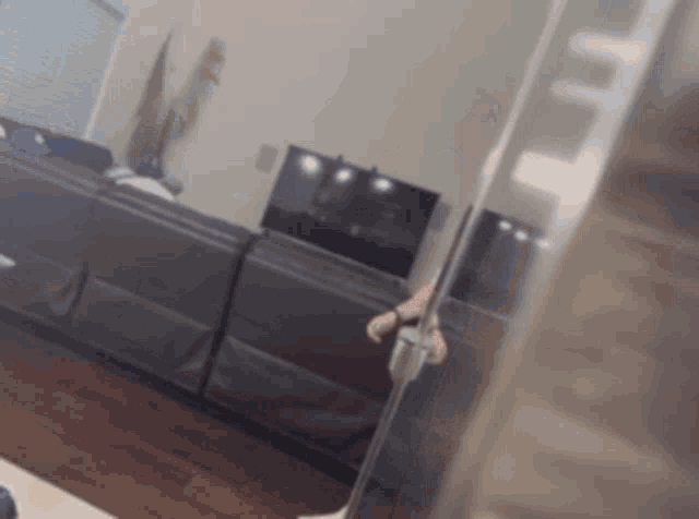 a blurred image of a living room with a couch and television