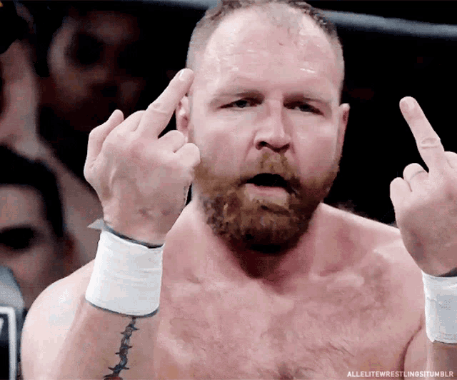 a man with a beard giving the middle finger
