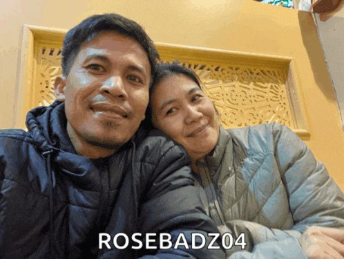 a man and woman posing for a picture with the name rosebadz04 on the bottom right