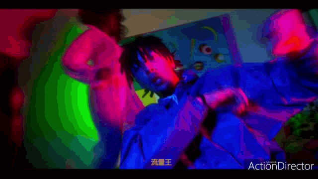 a colorful background with the words action director on the bottom left