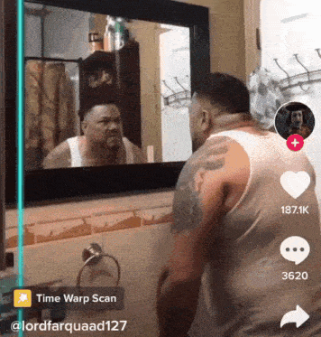 a man is looking at himself in a bathroom mirror with a time warp scan app open
