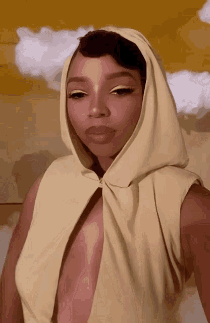 a woman wearing a hooded top with a very plunging neckline