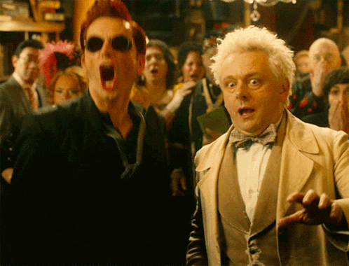 a man with sunglasses and a bow tie is screaming