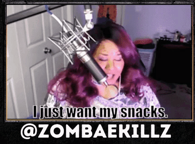 a woman with purple hair is singing into a microphone and the caption says i just want my snacks