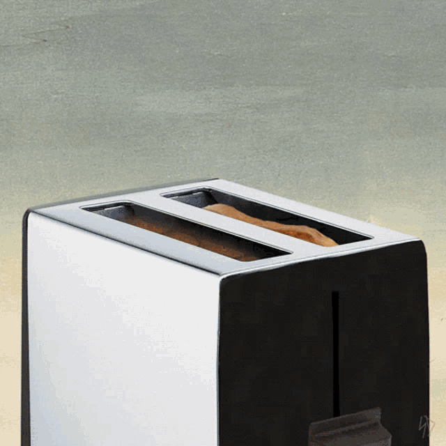a black and white toaster with a piece of bread in it