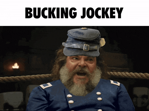 a man with a beard is wearing a hat that says bucking jockey on it